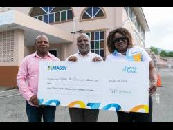 From left: Property Manager of Clifton New Testament Church of God, Leon Thompson; Senior Pastor Reverend Munroe Wisdom Sr; and Customer Service and Logistics Manager at IGL Limited, Geneve Barnett-Fraser, pose with the ceremonial cheque for $775,000. 