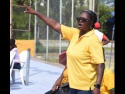 Coach Jones gives instructions from the sidelines.