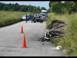 The scene of the crash that claimed the lives of two students along the Petersfield main road in Westmoreland on Tuesday morning.