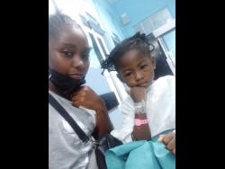 Kwician Baldin (left) and her daughter, Kenecia Wisdom.