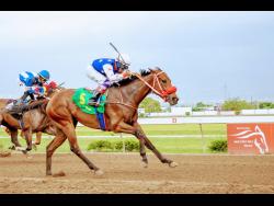 EMPEROROFTHECATS (right) and jockey Ramon Nepare win the Linval McFarlane Trophy for three-year-old and upwards open allowance race at Caymanas Park in March.