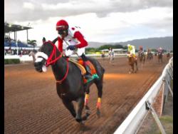 Madelyn’s Sunshine, ridden by Reyan Lewis, wins The Naz Hoshay Trophy over six furlongs for horses three years’ old and upwards, an overnight allowance stakes, at Caymanas Park on November 4.