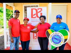 House recipient Audrey Ranger (second right) is flanked by representatives of the donors (from left), Dennis Beckford, D&G Foundation accountant; Totlyn Brown-Robb, D&G Foundation administrator; and  FFPJ Marketing and Development Manager, Marsha Burrell-Rose.