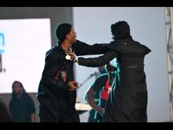 Fully Bad (left) and Honormosity exchange blows on stage at the 2023 staging of Sting at Jamworld in Portmore, St Catherine.