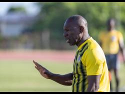 Coach Vassel Reynolds gives instructions to his Humble Lion players during their 2-1 Jamaica Premier League loss to Cavalier at Stadium East on Wednesday.