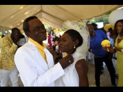Ephraim and Rena Manderson are all smiles on their wedding day.