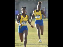 St. Elizabeth Technical High School’s (STETHS) Habiba Harris (left) romps to victory ahead of teammate Shanise Ellis in heat two of the Class One girls’ 100 metres at the Grace/STETHS Invitational track and field meet on Saturday at STETHS. Harris won in 11.89 seconds with Ellis doing 12.56. Harris’ time was the quickest of the three heats.