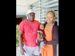 Lorenzo Williams (left) and spouse Annette Tobias with Zahir.