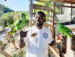 Orayne Graham with a pair of parrots. 