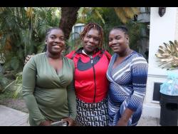 Proud mom Gloria Reid (centre) with her daughters Reasheal (left) and Reacheal Wallace. 