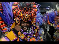 A performer from the Salgueiro samba school parades during Carnival celebrations at the Sambadrome in Rio de Janeiro, Brazil, yesterday.