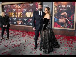 Ben Affleck and Jennifer Lopez arrive at the premiere of “This Is Me... Now: A Love Story” on Tuesday at the Dolby Theatre in Los Angeles. Lopez is performing a kind of fictionalised mea culpa about her past romantic relationships in the musical film.