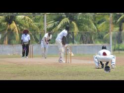 Veteran seamer Lascelles Davis (second left) picked up two wickets for Old Harbour in their win over Basement on Sunday. 