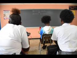 Teen mothers attend a class facilitated by the Women’s Centre of Jamaica Foundation. 