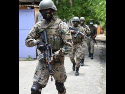 Members of the Jamaica Defence Force on patrol.