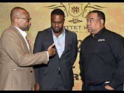 Director of Tourism Donovan White (left) with Christopher Wills (centre), vice-president of Operations, Supreme Ventures Racing and Entertainment Limited and Gary Peart (right), chairman, Supreme Ventures Limited, at the launch of the Mouttet Mile at the AC Hotel in New Kingston yesterday. 