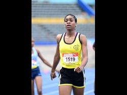 Alphansus Davis's Alikay Reynolds exhales after winning the Class Three girls' 1,500 metres at the ISSA/GraceKennedy Boys and Girls' Athletics Championships at the National Stadium today. Reynolds clocked 4:43.92 minutes.