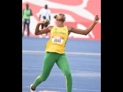 St Jago’s Kimeka Smith grimaces as she is about to heave the shot put on Wednesday, on her way to breaking the Class Two girls’ shot put record at the ISSA/GraceKennedy Boys and Girls’ Athletics Championships taking place at the National Stadium. Smith threw 16.44 metres to break the 2018 record of 15.99 metres by former Immaculate Conception High thrower Danielle Slolely.