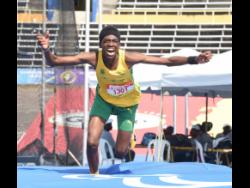 St Jago High’s Nikaro Johnson celebrates his victory in the Class Three boys’ high jump after clearing 1.87 metres at the ISSA/GraceKennedy Boys and Girls’ Athletics Championships at the National Stadium on Thursday.