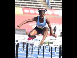 Edwin Allen's Tashana Godfrey clears the final hurdle on her way to winning heat two of the Class Four girls' 70 metres hurdles at the ISSA/GraceKennedy Boys and Girls' Athletics Championships at the National Stadium today. Godfrey clocked 10.71 seconds.