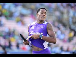 Marcinho Rose eases after anchoring Kingston College to victory in the Open boys' 4x400 metres semi-finals at the ISSA/GraceKennedy Boys and Girls' Athletics Championships at the National Stadium this afternoon. KC won in 3:15.95 minutes.