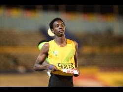 Excelsior High's Demarco Bennett celebrates his victory in the Class Two boys' 400 metres hurdles in 51.70 seconds at the ISSA/GraceKennedy Boys and Girls' Athletics Championships at the National Stadium tonight.