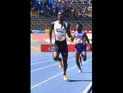 Jamaica College's Kemarrio Bygrave (left) moves away from Kingston College's Jaquan Coke to win Class One boys' 800 metres at the ISSA/GraceKennedy Boys and Girls' Athletics Championships at the National Stadium today. Bygrave clocked in 1:51.75 minutes.