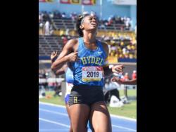 Hydel HIgh's Alliah Baker gets emotional after winning the Class One girls' 200 metres final in 22.89 seconds at the ISSA/GraceKennedy Boys and GIrls' Athletics Championships at the National Stadium today.