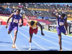 Kingston College's Amal Glasgow (right) out-dips Wolmer's Boys' School's Gary Card (centre) and teammate Marcinho Rose to win the Class One boys' 200 metres at the ISSA GraceKennedy Boys and Girls' Athletics Championships at the National Stadium today. Glasgow won in 21.22 seconds.