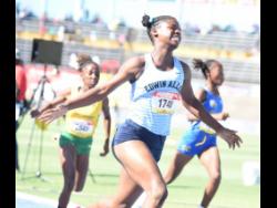 Edwin Allen High's Tashana Godfrey is ecstatic to win the Class Two girls' 70 metres hurdles in 10.43 seconds at the ISSA/GraceKennedy Boys and Girls' Athletics Championships at the National Stadium today.
