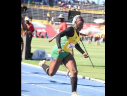 St. Jago High’s Bryana Davidson is ecstatic after winning the gold medal in the 100 metres hurdles in 13.18 seconds at the ISSA/GraceKennedy Boys and Girls' Athletics Championships at the National Stadium today.