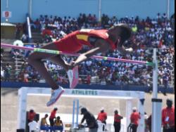 Shanniqua Williams of Wolmer's Girls' School, clears the bar to win the Class Two girls' high jump at the ISSA/GraceKennedy Boys and Girls' Athletics Championships at the National Stadium today.