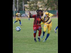 Montego Bay United’s Johann Weatherly (left) and Molynes United’s Odane Samuels battle for the ball, during their Wray and Nephew-sponsored Jamaica Premier League match, at the Montego Bay Complex Sports Complex in Montego Bay yesterday. Montego Bay won 2-1.