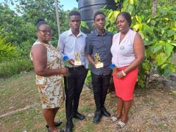 From left:  Jenice Baker, her son Yoshane Bowen, Jayden Brown and his mother Tacia Williams pose for the camera following the award ceremony put on by the Children of Light Outreach Foundation at the Jointwood Seventh-day Adventist Church, St Elizabeth, on Sunday.