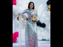 Credit: Contributed Kaylia ‘Press Kay’ Williams shows off her award.