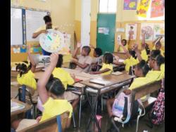Mathematics Teacher of the Year, Cameka Ingram, conducts a lesson with her grade-three students at Green Pond Primary and Infant School in St James.