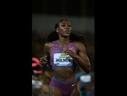 United States of America's Alexis Holmes eases after winning the women's 400 metres at the Jamaica Invitational at the National Stadium tonight.