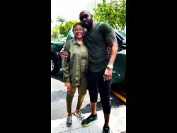 Da’Ville shares a moment with Marcia Griffiths.