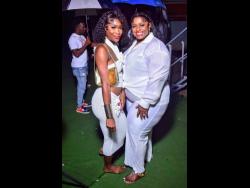 Leneisha (left) and Jackie stun in pristine white attire, striking poses that steal the spotlight at the recent Soul Food Tuesdayz event, hosted at Hyde Park Football Field on Lower Mall Road in St Andrew.