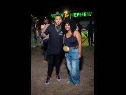 Skunk Nation’s Nick Lue (left) enjoys a moment in the spotlight alongside  Kerry Ann Bryan, Wray & Nephew White Overproof Rum brand manager.