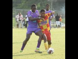 Cornwall College’s Dane Buckley (right) and  Irwin High’s Kenoy Morant  battle for the ball during an ISSA-daCosta Cup match at the Irwin High Sports Complex in St James on October 3, 2023.