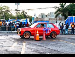 Credit: Contributed Photos Sixteen-year-old Zidan Madden drifting his car at the Scott Auto’s Wet Slippery Wen Wett Drift Dexterity event held at Overton Plaza in Montego Bay on Thursday, May 23.
