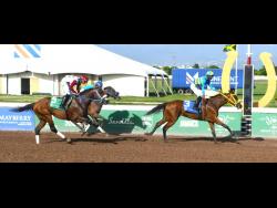 RHYTHM BUZZ, ridden by Reyan Lewis, wins the Mark My Word Trophy race over nine furlongs and 25 yards  at Caymanas Park on Saturday, June 15.