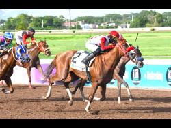 THALITA (2), ridden by Tevin Foster, wins the eighth race over 6 -1/2 furlongs at Caymanas Park on Sunday, July 7, 2024.