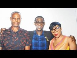 Newly minted doctor Rashaun Stewart (centre) with his parents Christopher and Tasawn Stewart.