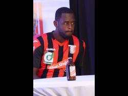 Photo shows Oneil ‘Bigga’ Thompson at a press conference while he was captain of Arnett Gardens FC. Thompson has taken on the role of head coach of Clarendon’s Jamaica Premier League team Chapelton Maroons.