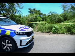 Credit: Antoine Lodge Police cordon off the area where the body of Rahjaun Melbourne, who died while trying to save a drowning woman, was found.