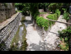 Credit: Antoine Lodge The section of the gully off Waltham Park Road in St Andrew where Rahjaun Melbourne and Monique Nelson were washed away from last Tuesday. Nelson was rescued but Melbourne didn’t survive.