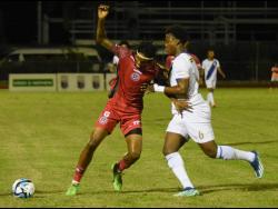 Montego Bay United’s Shaneil Thomas (left) competes for the ball with Harbour View’s Devonti Hodges during their Jamaica Premier League encounter at the Montego Bay Sports Complex on Monday night. Harbour View won 2-1.