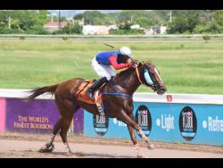 ASHE’S DALLAS LOVE, ridden Oneil Mullings, winning the first race over five furlongs round at Caymanas Park on Monday.